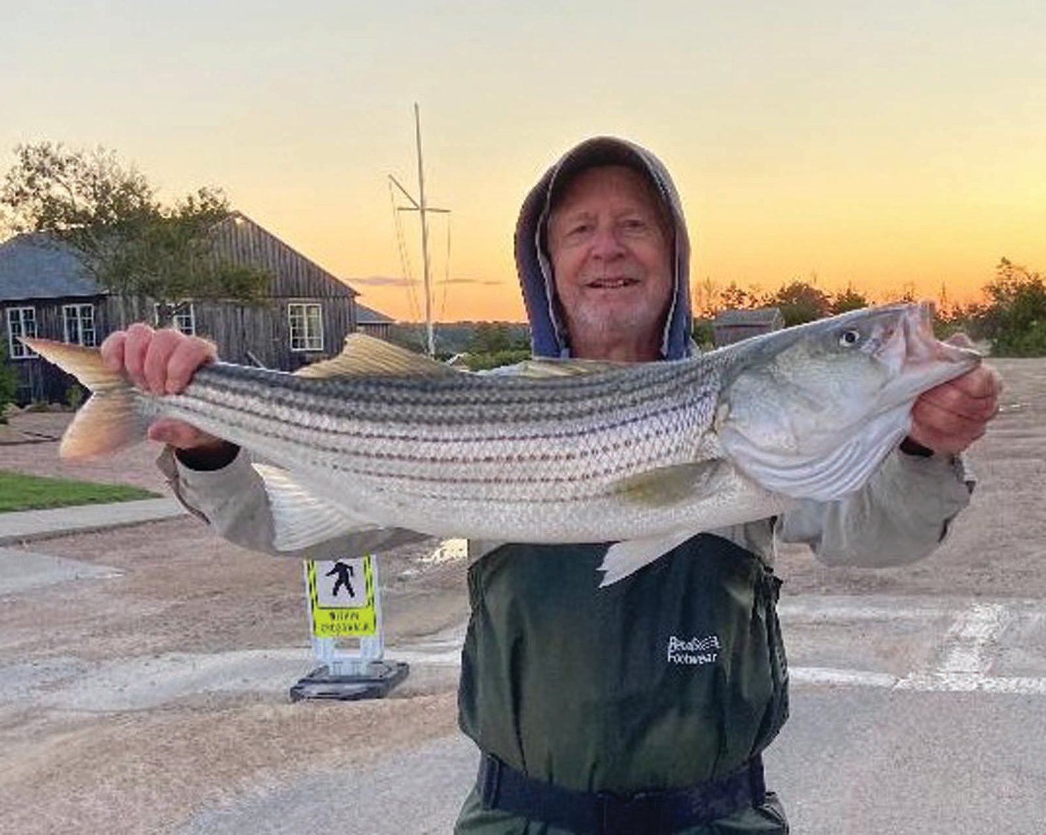 GOOD STRIPER BITE:  Gil Bell with a keeper striped bass said, “There was so much bait in the water so I decided not to match the hatch and used a six inch plug with success.”